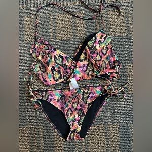 Dazed woman’s bikini size M & 34 C cup